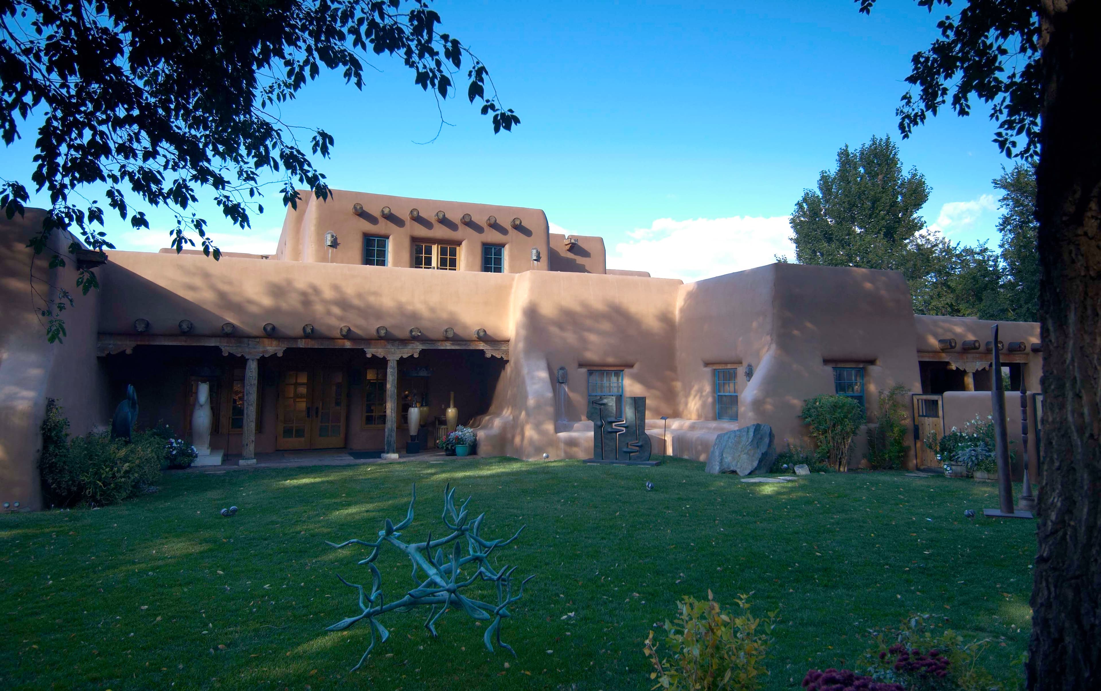 The adobe courtyard and sculpture garden lawn at Gerald Peters Gallery in Santa Fe
